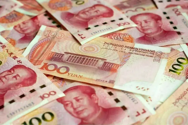 China’s yuan slips against dollar, but rises to 7-month high vs currency basket