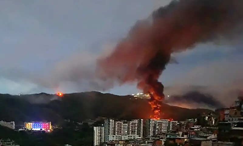 Fire at Fuerte Tiuna, Venezuela&rsquo;s largest military complex, is seen from a distance after a series of explosions in Caracas on January 3, 2026. Photo: AFP