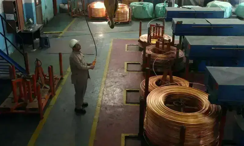 Copper falls on China demand concerns, but heads for weekly gain