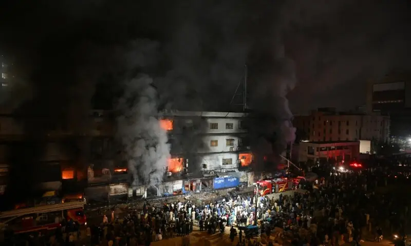 Firefighters douse a fire that broke out at a shopping mall in Karachi on January 18, 2026. Photo: AFP
