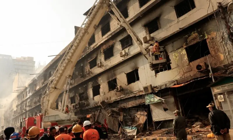 Emergency personnel search for survivors, following a massive fire that broke out in the Gul Plaza Shopping Mall in Karachi on January 19, 2026. Photo: Reuters
