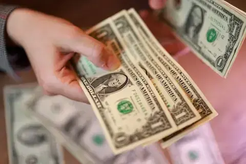 Dollar strengthens as confidence recovers, Fed hike bets trimmed
