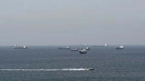 Trump, Iran cite progress in talks as uncertainty hangs over Strait