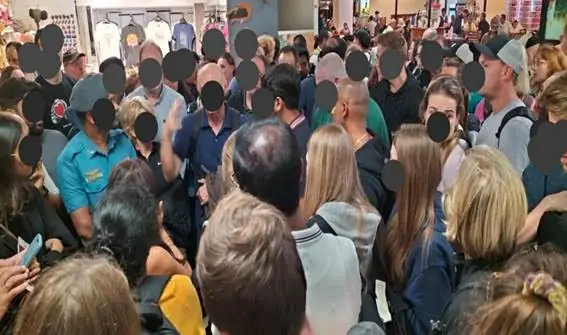 The floods outside created a crisis inside. After check-in, nowhere to go. Passengers surround airport staff, pleading for answers. The demand was simple: make arrangements. Get us home.