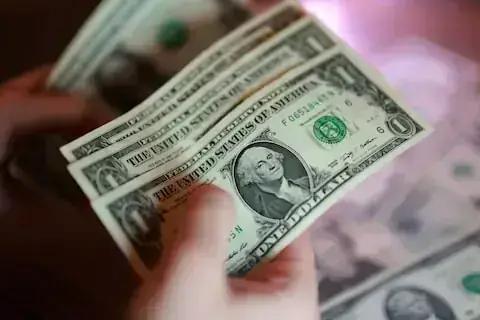 Rupee inches up against US dollar