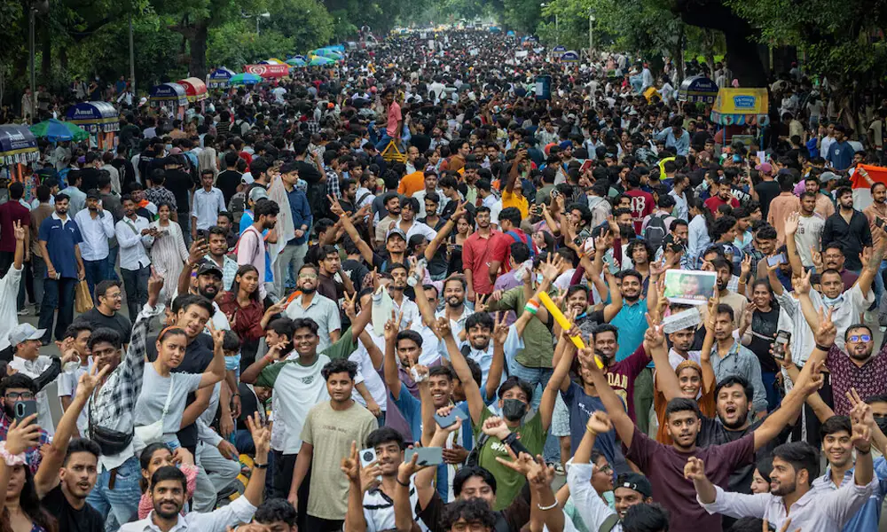 Thousands of protesters celebrated the resignation of Education Minister Dharmendra Pradhan in New Delhi on July 25. His departure after questions for a medical school exam were leaked was a rare concession by the Modi government. REUTERS