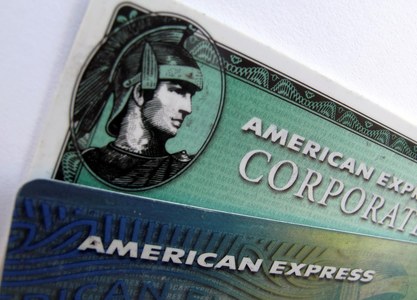 AmEx warns of slow spending recovery as credit losses loom