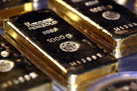 Gold soars to all-time high as dollar dive adds fuel to record run