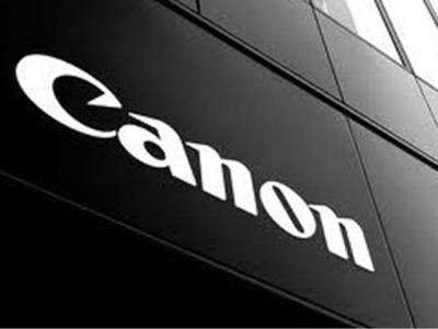 Canon reports first ever quarterly loss, cuts dividend Canon reports first ever quarterly loss, cuts dividend