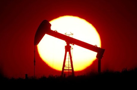 Oil rises as storm closes US production, inventories drop