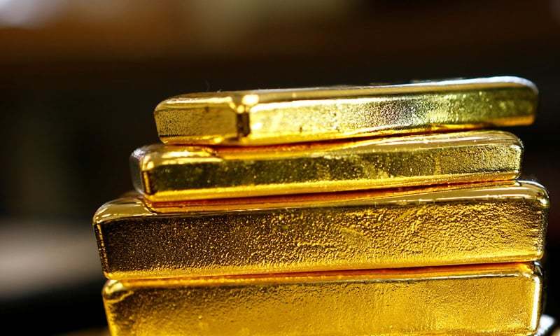 Gold falls 1pc on stronger dollar, economic rebound hopes