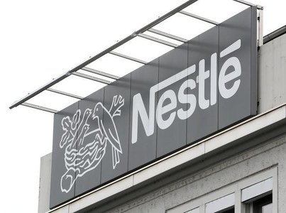 Nestle to spend big to cut carbon emissions while preserving profits