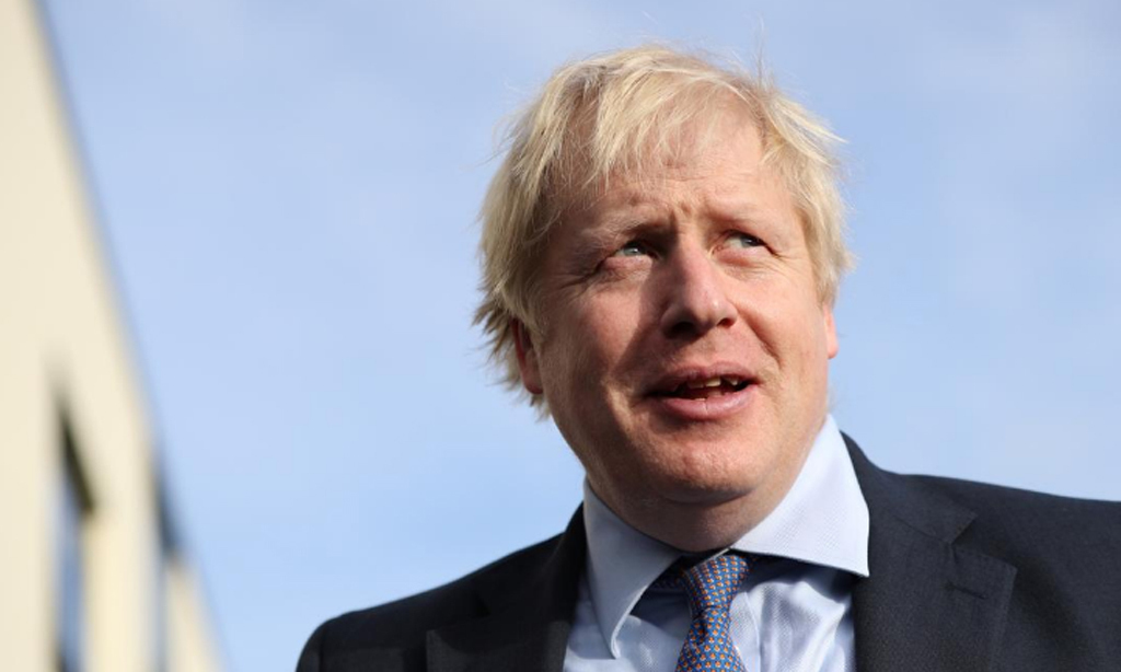 UK PM says vaccine will overcome COVID-19 but only gradually