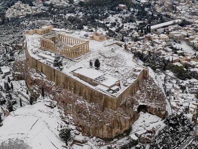 Greece races to restore power grid as cold snap recedes