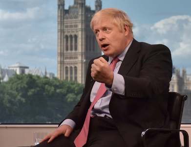 UK PM says no international travel until mid-May at earliest