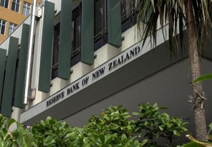 NZ central bank holds fire on rates, tempers tightening expectations