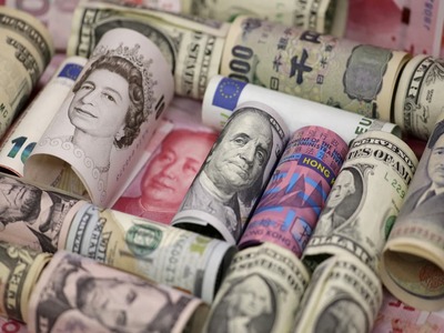 Dollar dips, Aussie jumps on global growth optimism
