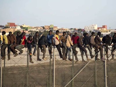 Dozens of migrants scale fence into Spain's Melilla enclave