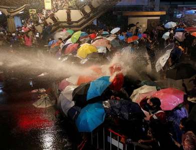 Thai police shoot water cannon at protesters near king's palace