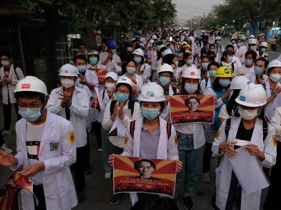 Protester shot dead in central Myanmar and two Australians in custody