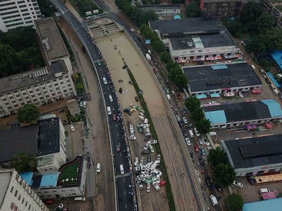 Chinese city picks through the debris after record rains kill 33 Chinese city picks through the debris after record rains kill 33