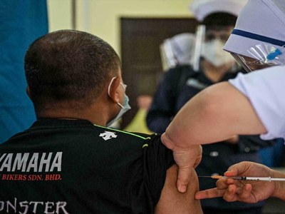 Malaysia to ease Covid restrictions for fully vaccinated in eight states