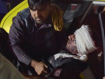 Islamic State suicide bombers kill scores at Kabul airport