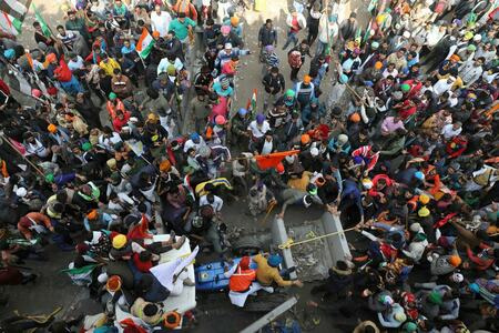 Indian farmers hold mass rally, keep pressure on Modi despite climbdown