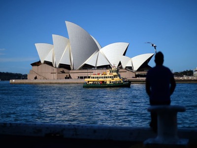 Australia treasurer tests positive for COVID-19 as daily cases soar past 100,000