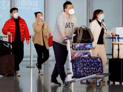 China says not granting passport renewals for non-essential travel
