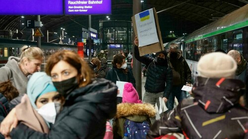 Tired and emotional, Ukrainians arrive by train in Berlin