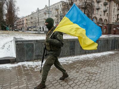 Ukrainians say they are fighting on in biggest city yet claimed by Russia