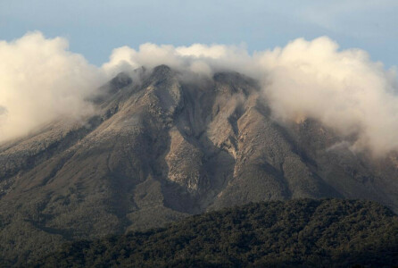 Philippines raises alert level at restive volcano after spewing cloud of ash