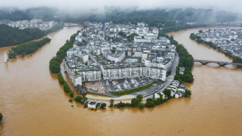 Hundreds of thousands evacuated in China after heaviest rains in decades