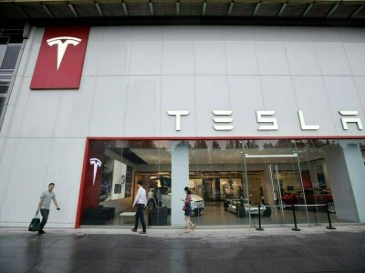Hit by China shutdown, Tesla boosts auto prices and sells bitcoin