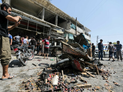 At least 14 killed in shelling on north Syria market, rescuers say