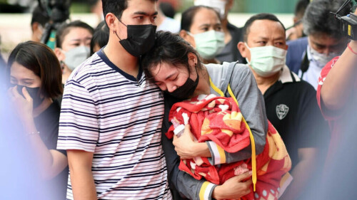 Distraught parents lay white roses for Thai nursery massacre victims