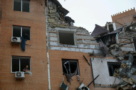 Russia hits Ukraine homes, evacuates Kherson, warns of escalation