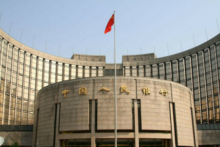 China central bank says yuan to remain stable, hopes for soft landing in housing market