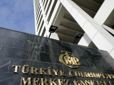 Turkish central bank lowers rate to 9%, says it will halt easing
