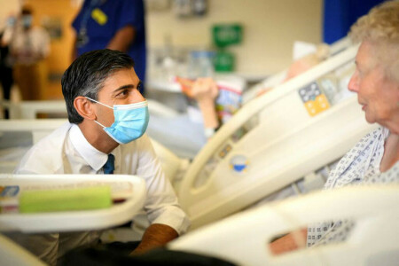 England rushes to discharge hospital patients to ease bed-blocking crisis