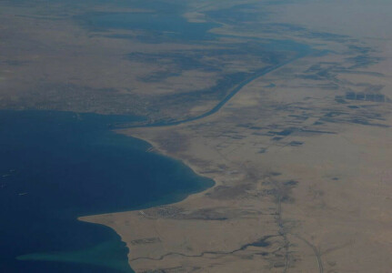 Efforts under way to refloat ship stuck in Suez Canal, authority says