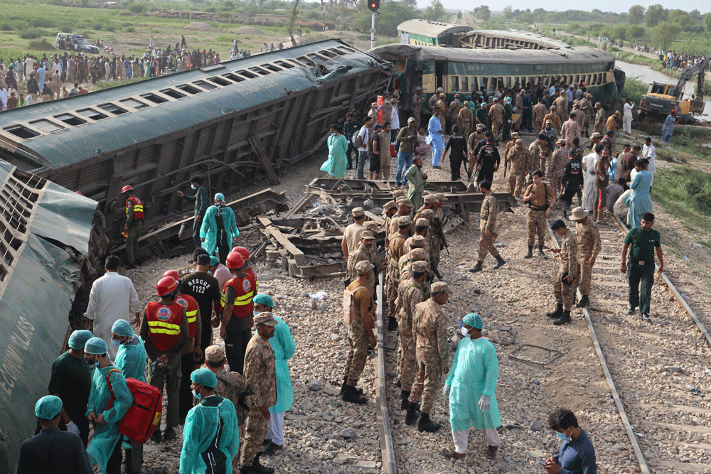 Hazara Express: investigators scour wreckage after deadly train crash in Pakistan