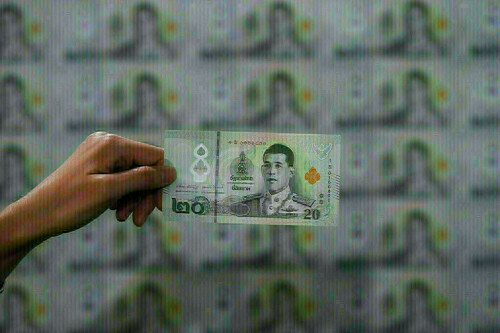 Asian currencies drop after US dollar gains on hawkish Fed (.)