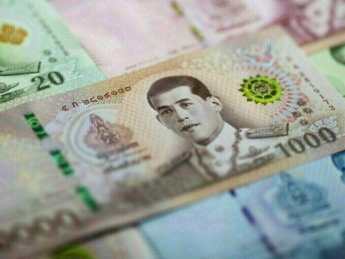 Thai baht leads Asian currencies lower, pressured by dollar