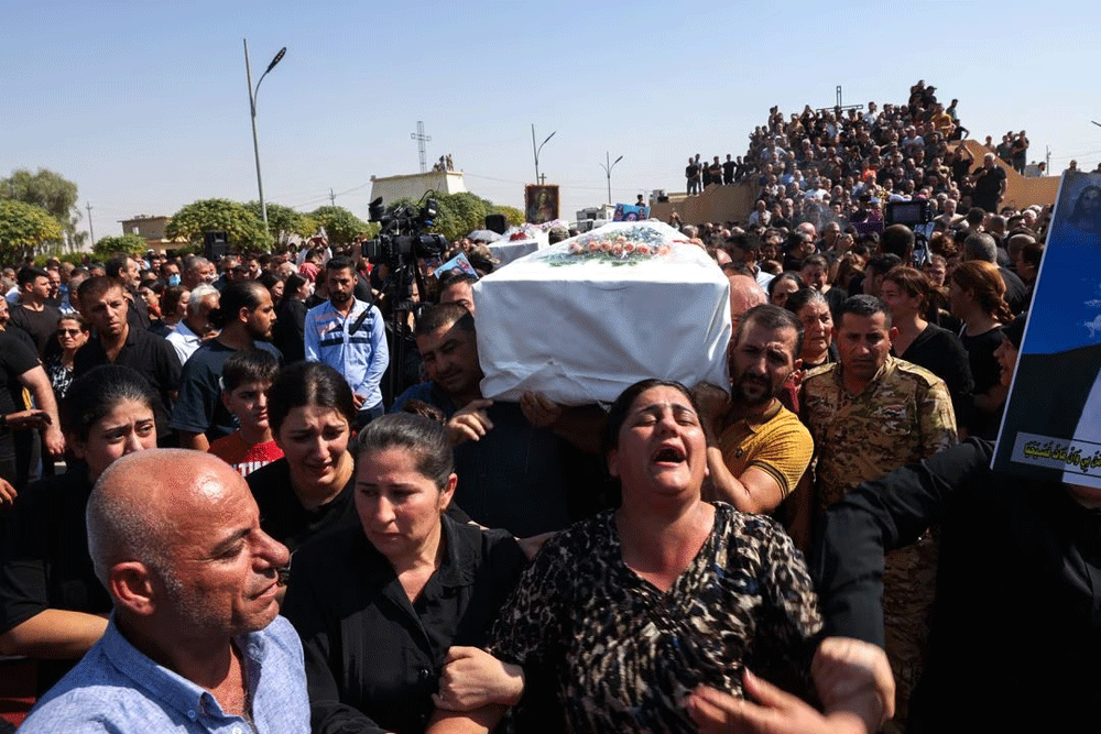 Mourners demand accountability, bury loved ones after Iraq wedding inferno