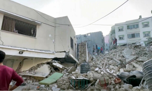 Israel levels Gaza district, hits Orthodox church as invasion looms