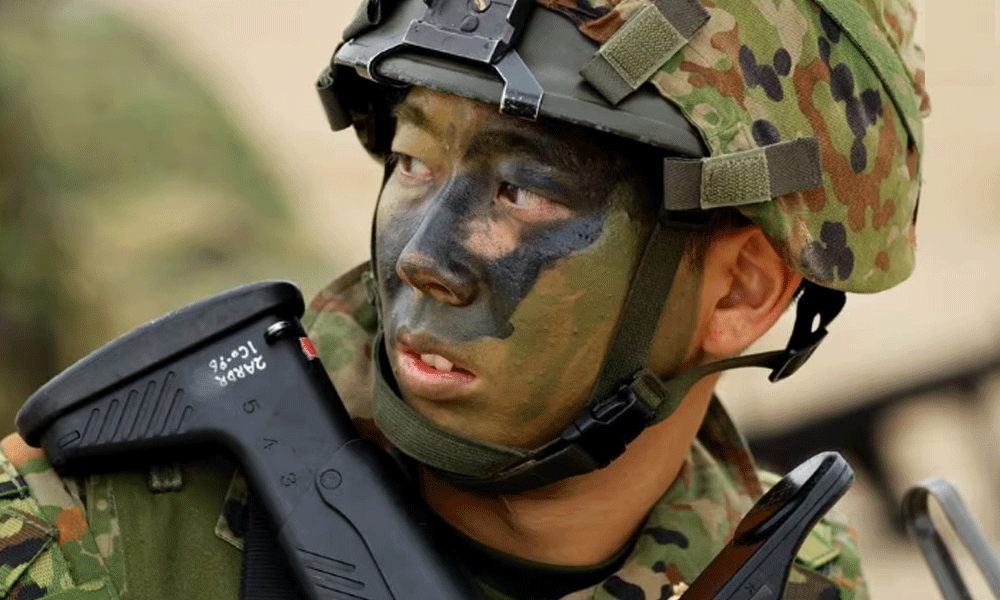 Japanese troops drill on island seen as vulnerable to China