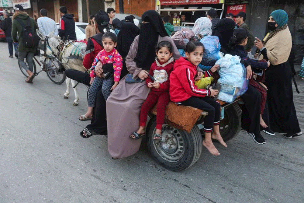 Happy but uncertain, displaced Palestinians try to head home to north Gaza