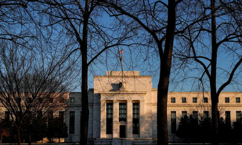 Fed flags end of rate hikes, sees lower borrowing costs in 2024